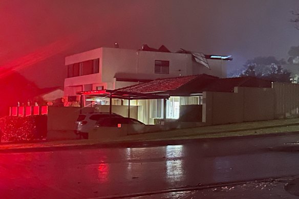 A home in City Beach, along Kalari Drive, where the roof has been severely damaged. 