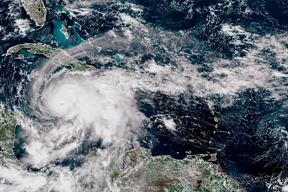 In this handout satellite image provided by the National Oceanic and Atmospheric Administration, Hurricane Melissa churns northwest through the Caribbean Sea. Hurricane Melissa has intensified into a Category 5 storm as it approaches Jamaica, according to the National Hurricane Center. 
