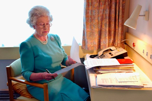 Queen Elizabeth at works on the Royal Train in 2002.