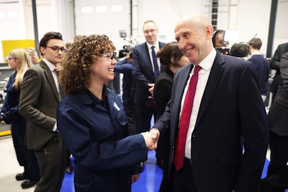 British Defence Secretary John Healey speaks to a Rolls-Royce apprentice during a visit to the company’s Nuclear Skills Academy in Derby in January.