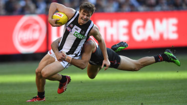 Gotcha: Adam Saad runs down Josh Thomas on Anzac Day.