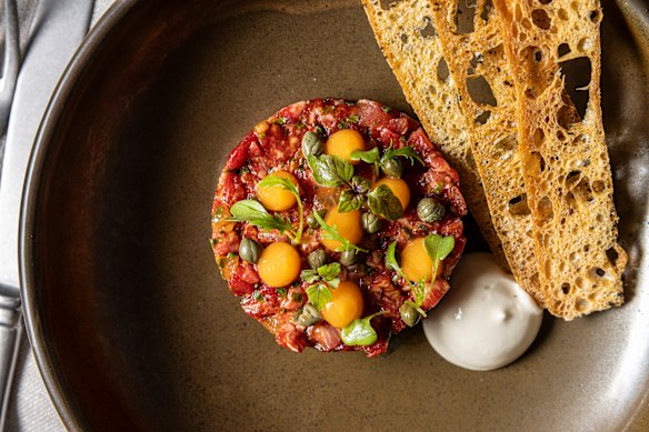 Mudo’s wagyu tartare, seasoned with shallots, chives, soy sauce and sesame oil, is mixed with diced nashi pear.