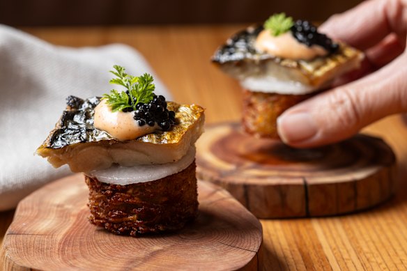  Potato rosti with salted cod roe, creme fraiche, mackerel and caviar.