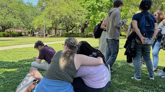 People comfort each other at Florida State University in Tallahassee, following Thursday’s shooting.