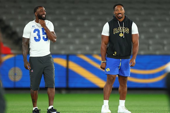 Myles Garrett (right) at Marvel Stadium with LA Rams teammate Jaylen Watson.