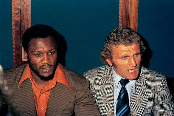 Bugner, right, with American boxer Joe Frazier in 1973.