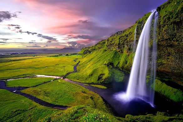 Iceland’s Seljalandsfoss waterfall … pair a natural phenomena with outdoor adventure.