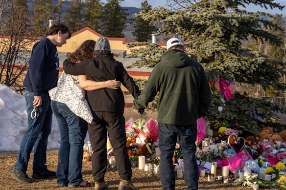 Tumbler Ridge residents gather at a memorial to the victims of Tuesday’s mass shooting.