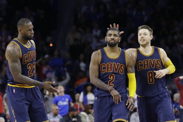 Matthew Dellavedova (right) shows his appreciation to teammate Kyrie Irving as NBA great LeBron James looks to get in on the action in their time at the Cleveland Cavaliers.