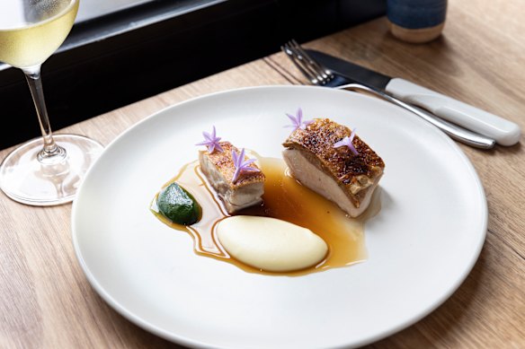 A La Cachette dish of roast chicken with parsley puree and mashed potato.