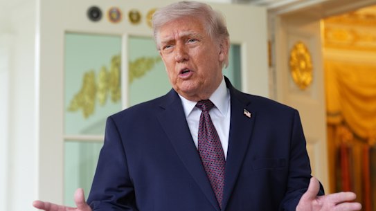 Trump talks to reporters at the White House on Monday.