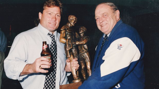 Terry Lamb and Peter Moore celebrate the 1995 premierships.