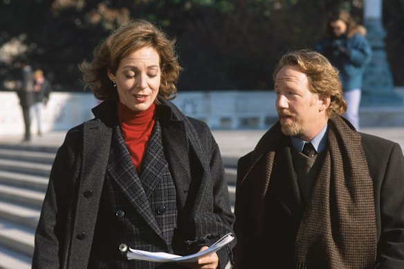 West Wing actor Timothy Busfield, pictured here with co-star Allison Janney, has turned himself in to authorities to face child sex abuse charges in New Mexico.