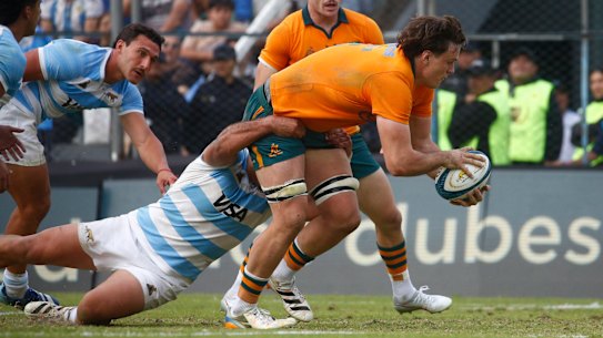 Tom Hooper of the Wallabies scores a try while being tackled by Ignacio Ruiz.
