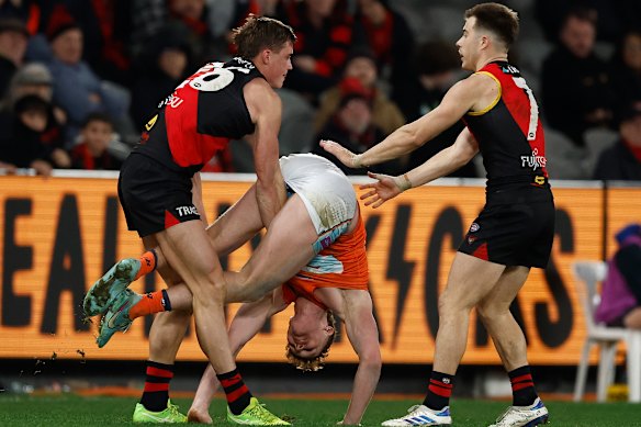  Essendon’s Archer May and Giant Tom Green.