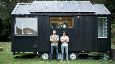 Brothers Chris and Cam Grant with one of their tiny houses.