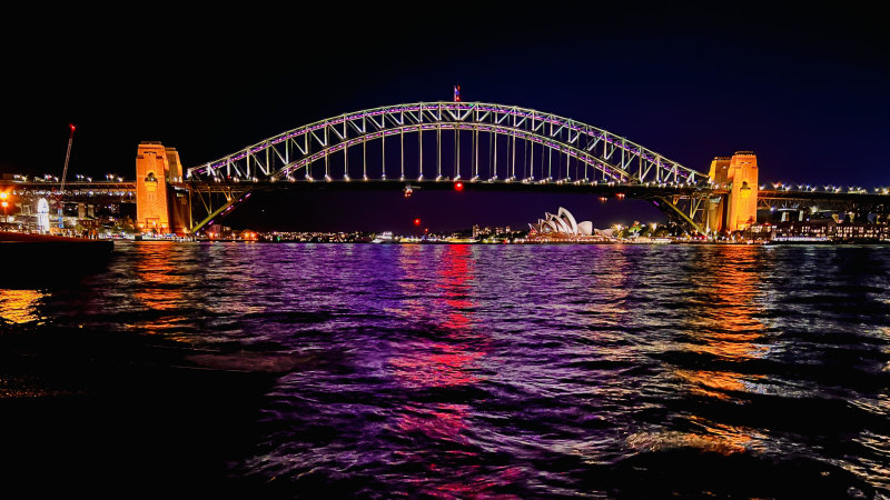Maroon city: Sydney Harbour Bridge lights up for Queensland