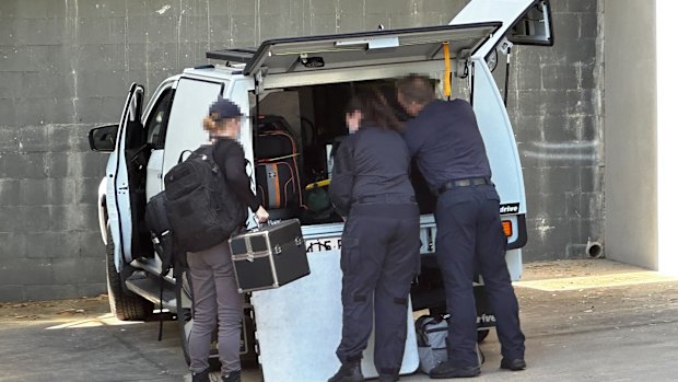Australian Federal Police at the couple’s unit complex in Everton Park, Brisbane.