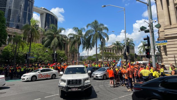 Members of the CFMEU and other unions rally in the Brisbane CBD before marching on state parliament to protest changes to Best Practice Industry Conditions (BPIC).