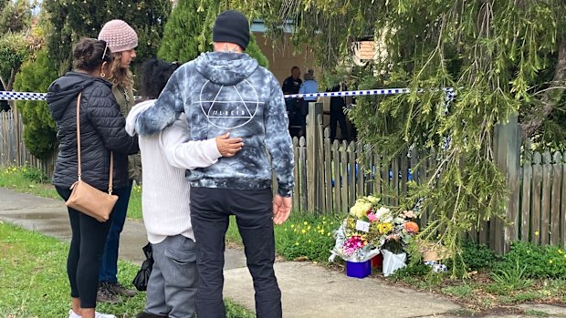 Family members and friends of Tiffany Woodley at the scene in 2023.