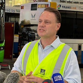 Adrian Schrinner announces the protective barrier rollout at the Toowong bus depot on Thursday. 