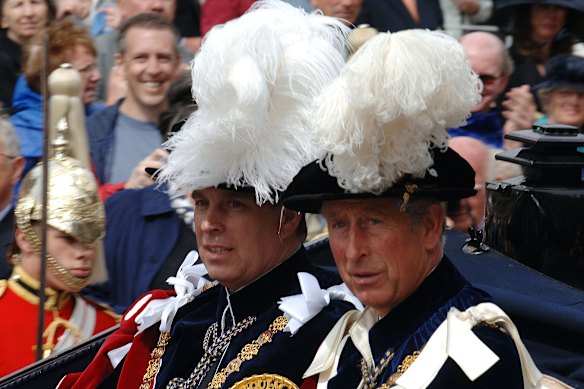 Andrew, left, with then prince Charles after the 2007 Order of the Garter ceremony.