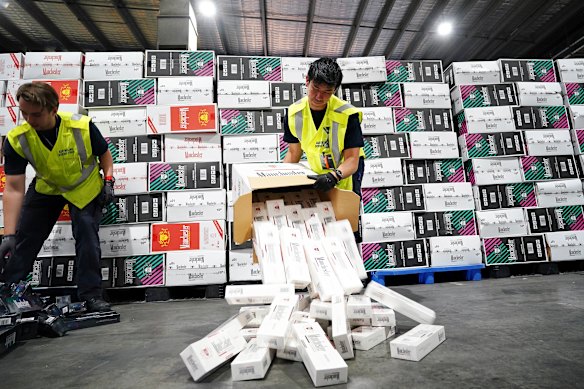 Australian Border Force officers with illegal cigarette imports found in shipping containers in Melbourne last year.