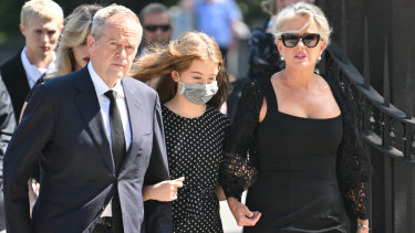 Former Opposition Leader Bill Shorten, his wife Chloe Shorten and daughter Clementine arrive at the funeral of Senator Kimberley Kitching.