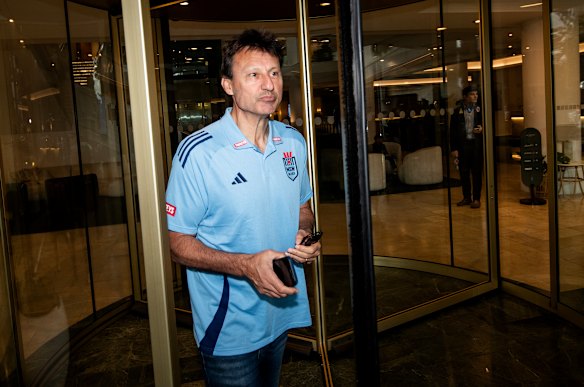 Laurie Daley on his way to front the media to explain the ins and outs of his Origin squad.