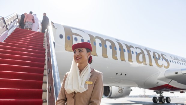 An Emirates Airline flight attendant near the airline’s first Airbus A350-900 aircraft during its unveiling at Dubai International Airport.