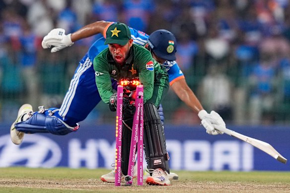 Pakistan keeper Usman Khan runs out  India’s Shivam Dube in Colombo on Sunday.