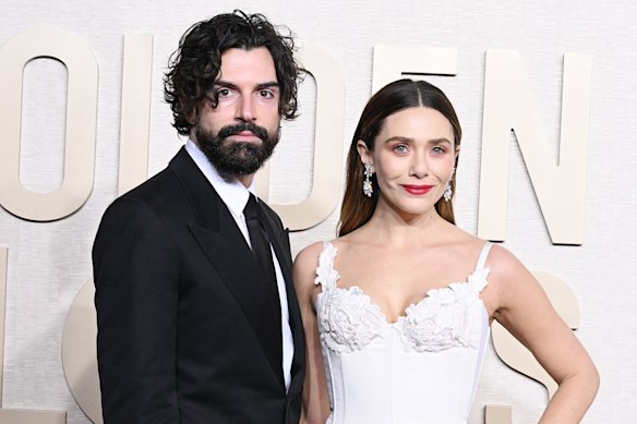 Elizabeth Olsen with Robbie Arnett at the 2024 Golden Globe Awards.