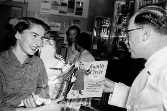 Peter Michael's grandfather, Harold Michael, with a customer. Alan Michael is in the background.