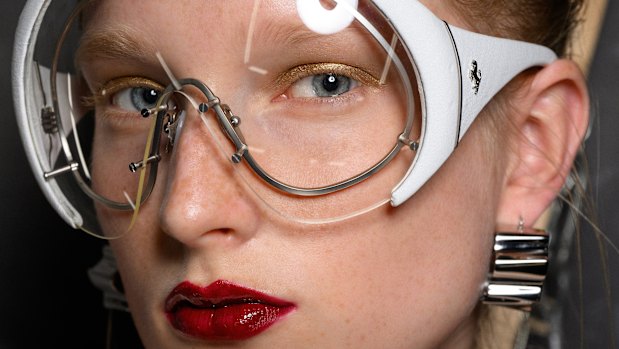 Mask sunglasses add a dash of F1 appeal on the catwalk at the Ferrari show for Milan Fashion Week 2024.