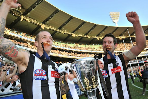 Dane Swan and Alan Didak celebrate the club’s 2010 premiership.