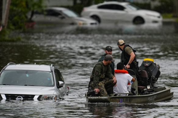 People are rescued from an apartment complex in Clearwater.