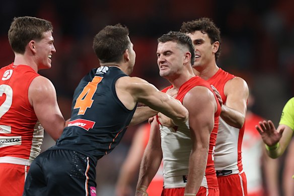 Toby Greene and Tom Papley get in each other’s faces.