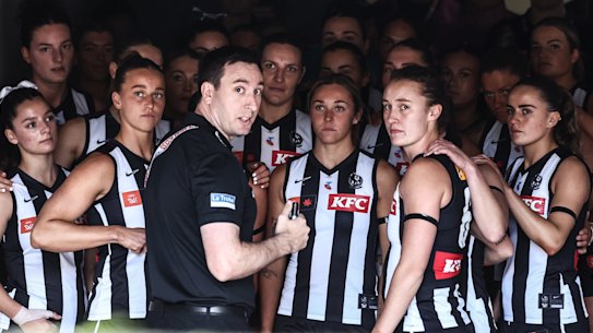 Collingwood coach Sam Wright and his team. 