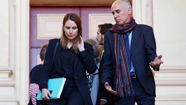 Hannah Quinn's lawyer Lauren MacDougall with Ms Quinn's father outside court on Tuesday. 