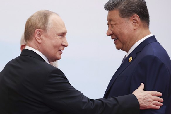 Vladimir Putin with Xi Jinping during the summit.