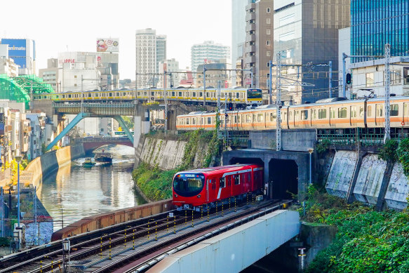 Tokyo metro subway and Yamanote line commuter trains running through the city.