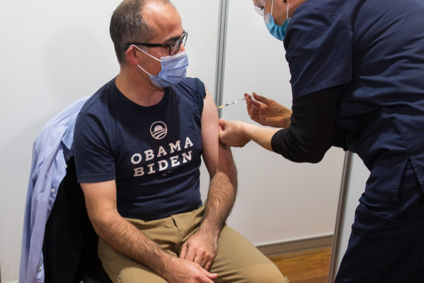 James Merlino being vaccinated on Friday.