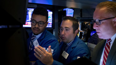 Traders on the New York Stock Exchange. US stocks rose amid hopes the US and China may be getting close to reaching a trade deal.