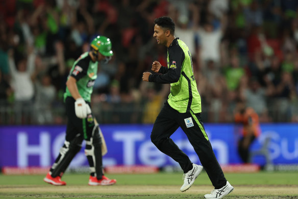 Tanveer Sangha of the Thunder celebrates after taking the wicket of Tom Curran.
