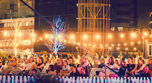 The audience at a 25th anniversary screening of Bring It On at an outdoor deck of the Star casino as part of the Brisbane International Film Festival.