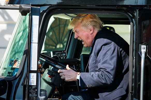 Petrol prices are a sensitive issue for US President Donald Trump, pictured behind the wheel of an 18-wheeler in 2017.
