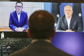 Premier Daniel Andrews and Prime Minister Scott Morrison address the media in a virtual press conference seen from Parliament House in Canberra on Saturday. 