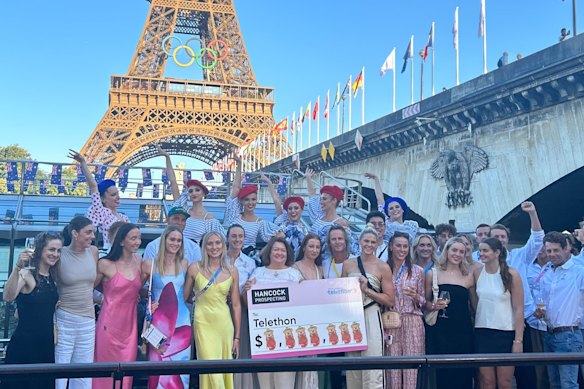 Gina Rinehart celebrates with some of Australia’s winning Olympians in Paris after the 2024 Games.