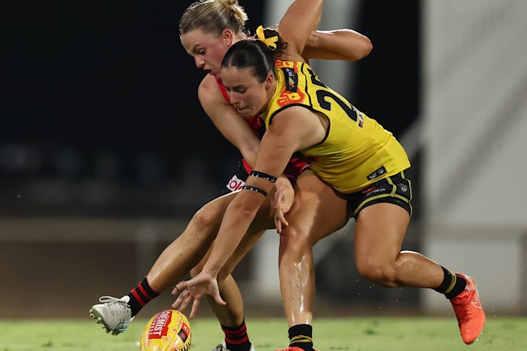 Sierra Grieves of the Tigers and Mia Busch of the Bombers in action.