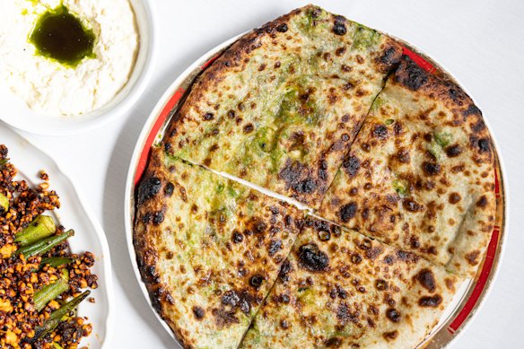 Pea-stuffed bread (right) with stracciatella cheese and burnt onion oil Kolkata Cricket Club.